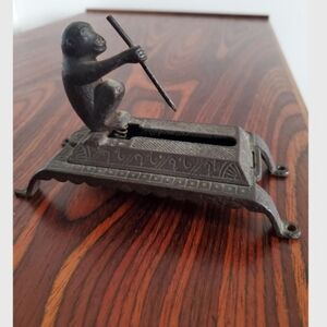 Antique match dispenser/1890s wooden match grabber/cast iron monkey spear